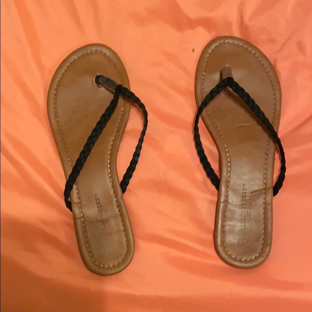 Black and brown flip flops